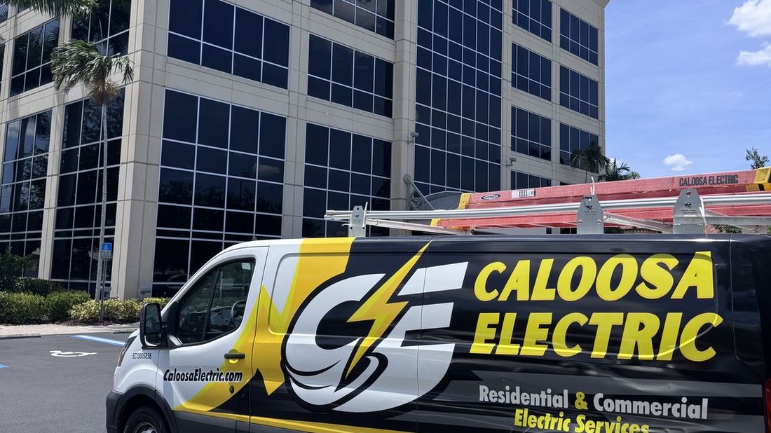 Caloosa Electric Service van, license EC13005838 on the front fender.